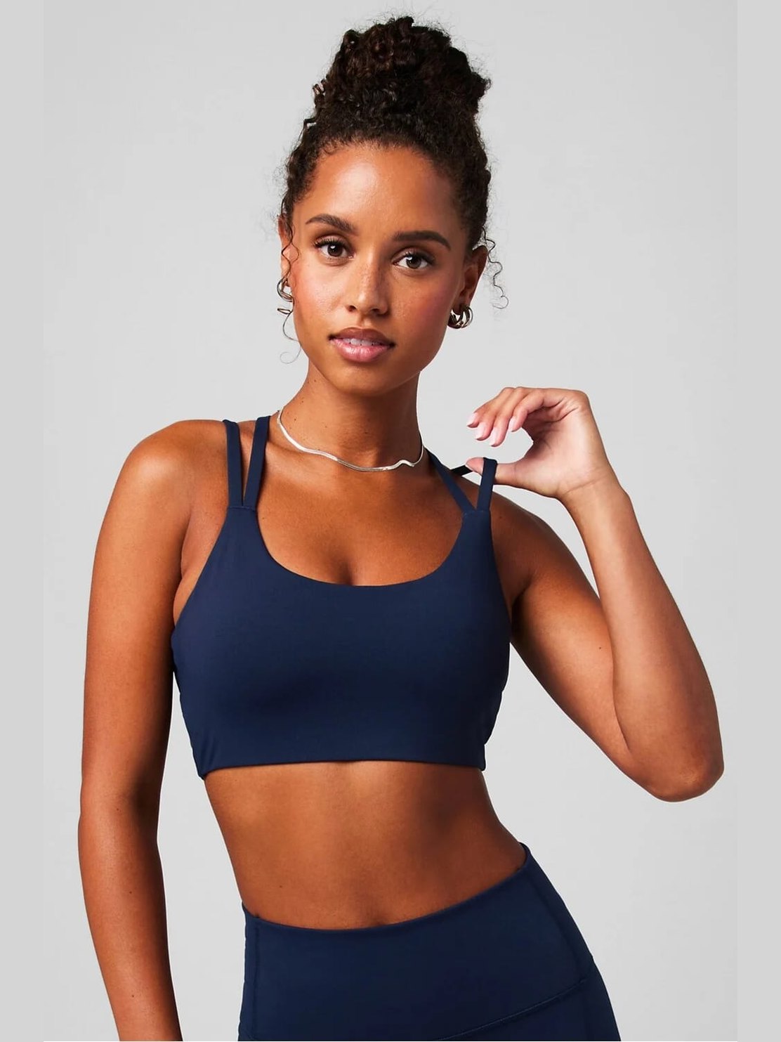 Navy blue Fabletics Principal low impact sports bra with square neckline, double straps, and ribbed texture