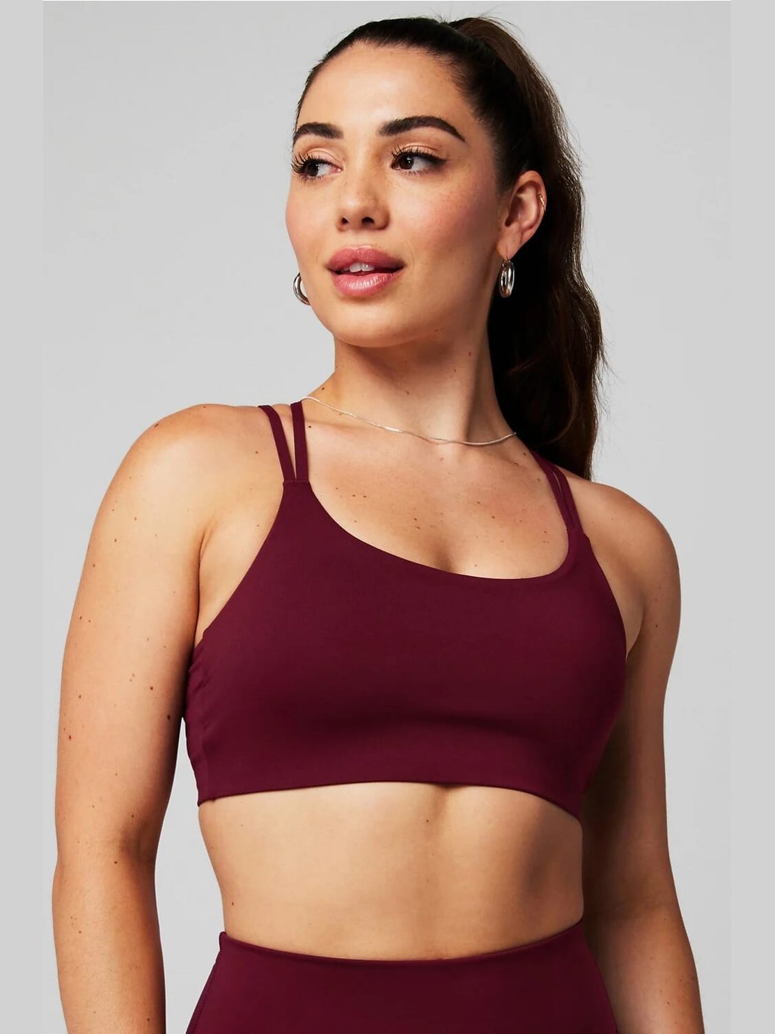 Maroon Fabletics Principal low impact sports bra with strappy racerback and adjustable straps