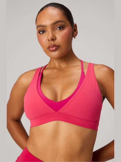 Fabletics Pureluxe double layer push-up low impact bra in fuchsia and hot pink with V-neck contrast panel