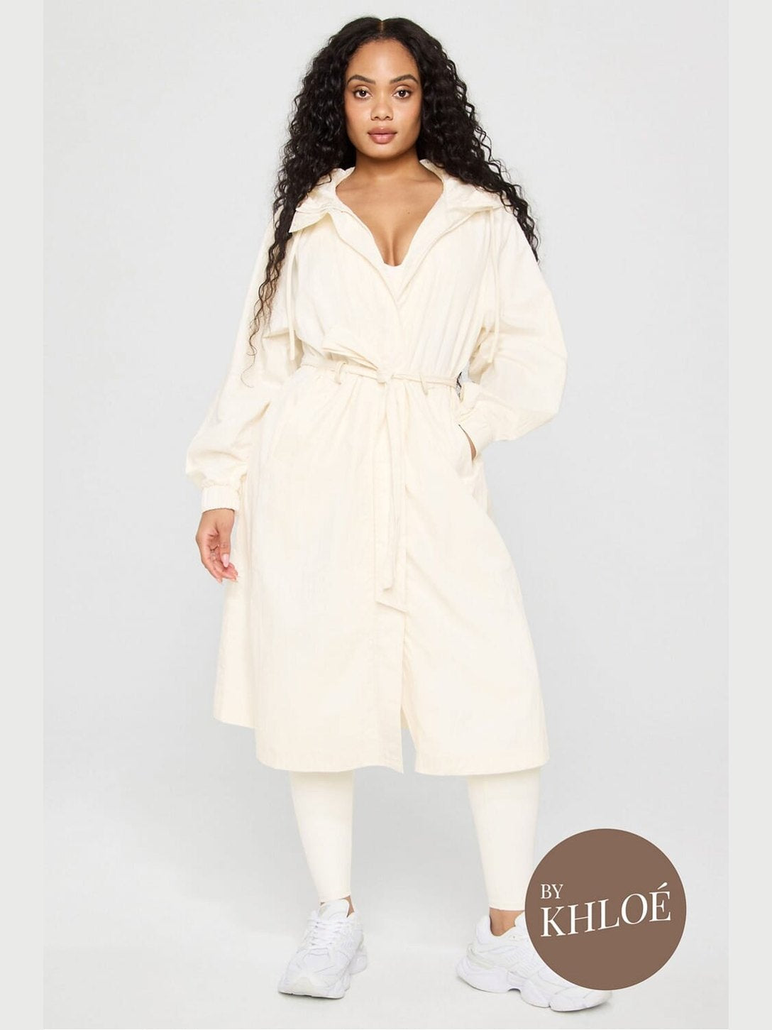Off-white Fabletics hooded trench coat with self-tie belt, relaxed fit, and matte woven texture