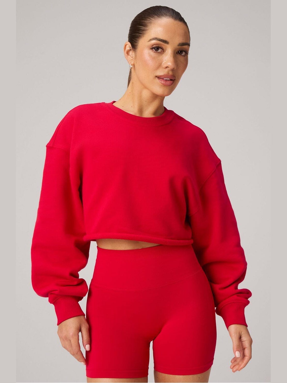 Fabletics red heavy terry cropped pullover sweatshirt with drop shoulders and raw hem