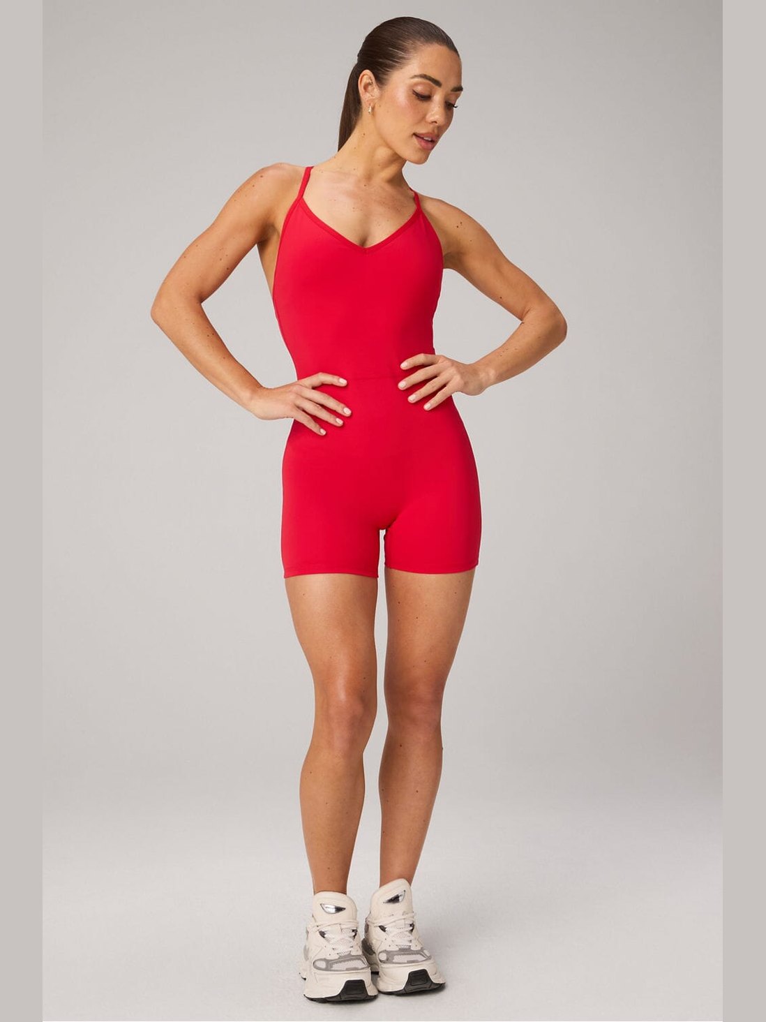 Women's red Fabletics PureLuxe V-back jumpsuit with booty scrunch, no-front-seam high-waist fit and short leg openings